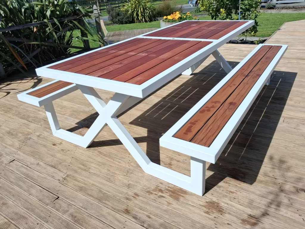 White aluminium picnic table with X-frame legs and hardwood bench seats