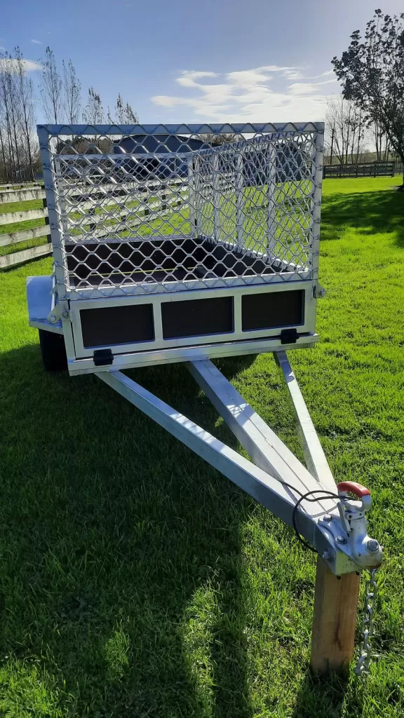 Front view of an 8x4 aluminium trailer with a mesh cage